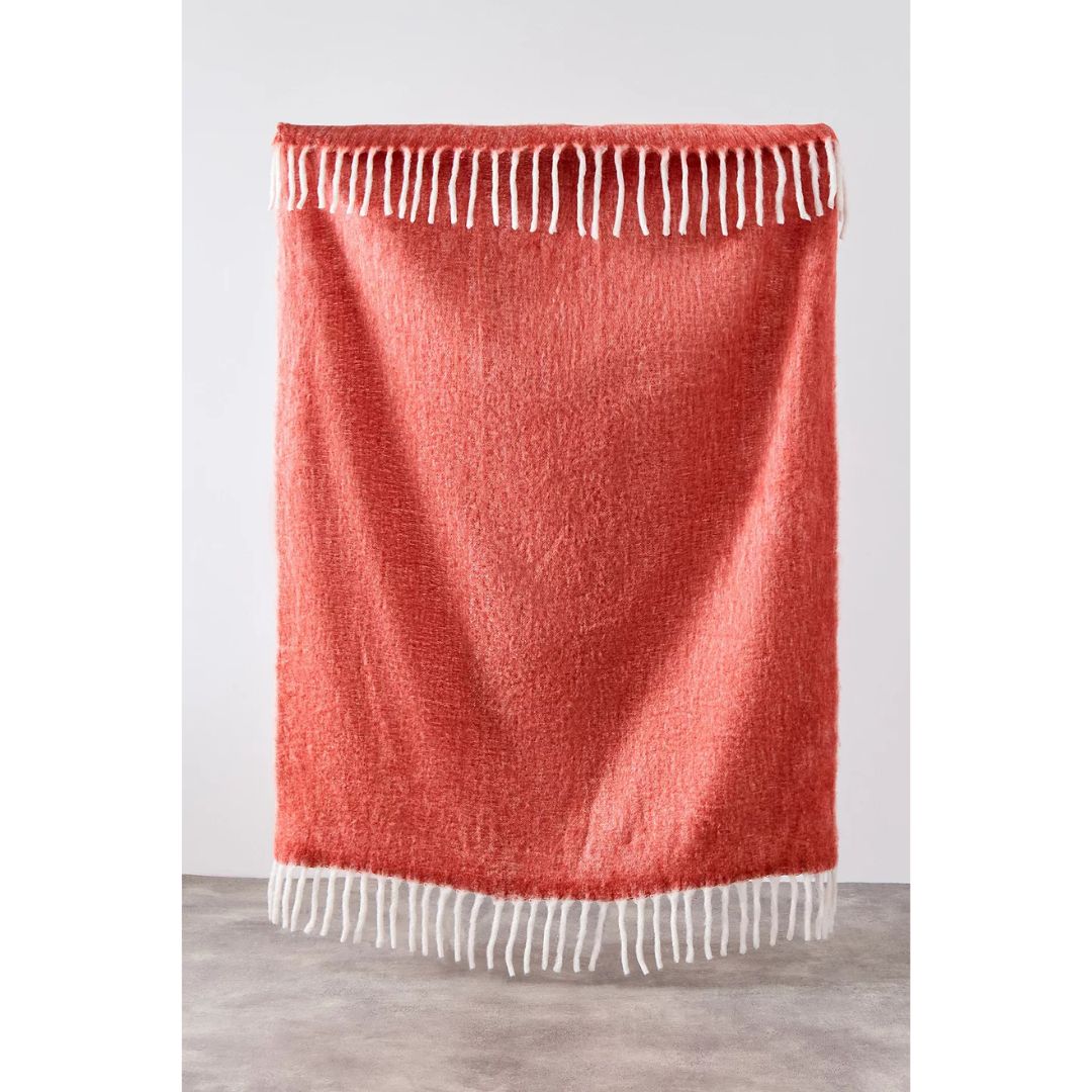 fringed red throw blanket with tassles