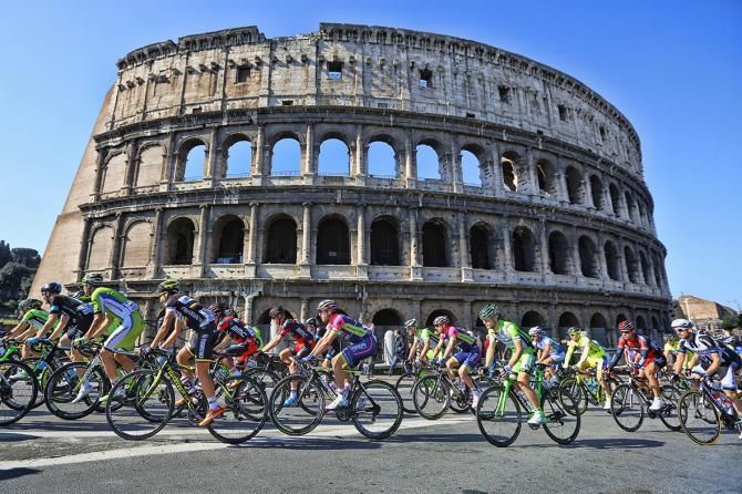 The peloton passes the Colosseum during Roma-Maxima