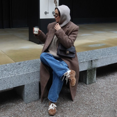 Fashion person Felicity Bird @felicitymbird wears a London Spring capsule wardrobe 2026. She wears a hood.