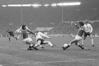 Bell, centre, is closed down by West Germany's Gerd Muller, left, and Paul Breitner, right, in England's defeat at the 1972 European Championship