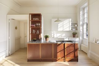 A kitchen peninsula made of contrasting material to the rest of the kitchen