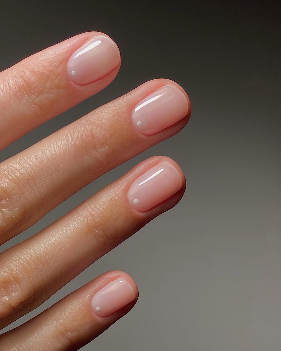 A manicure featuring tiny dots by Mate Jonava