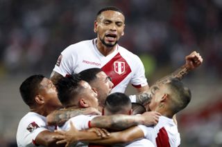 Peru players celebrate a goal against Chile in World Cup qualifying in October 2021.