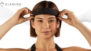 A woman places the Elemind neurotech headband on her head, the Elemind logo to the left