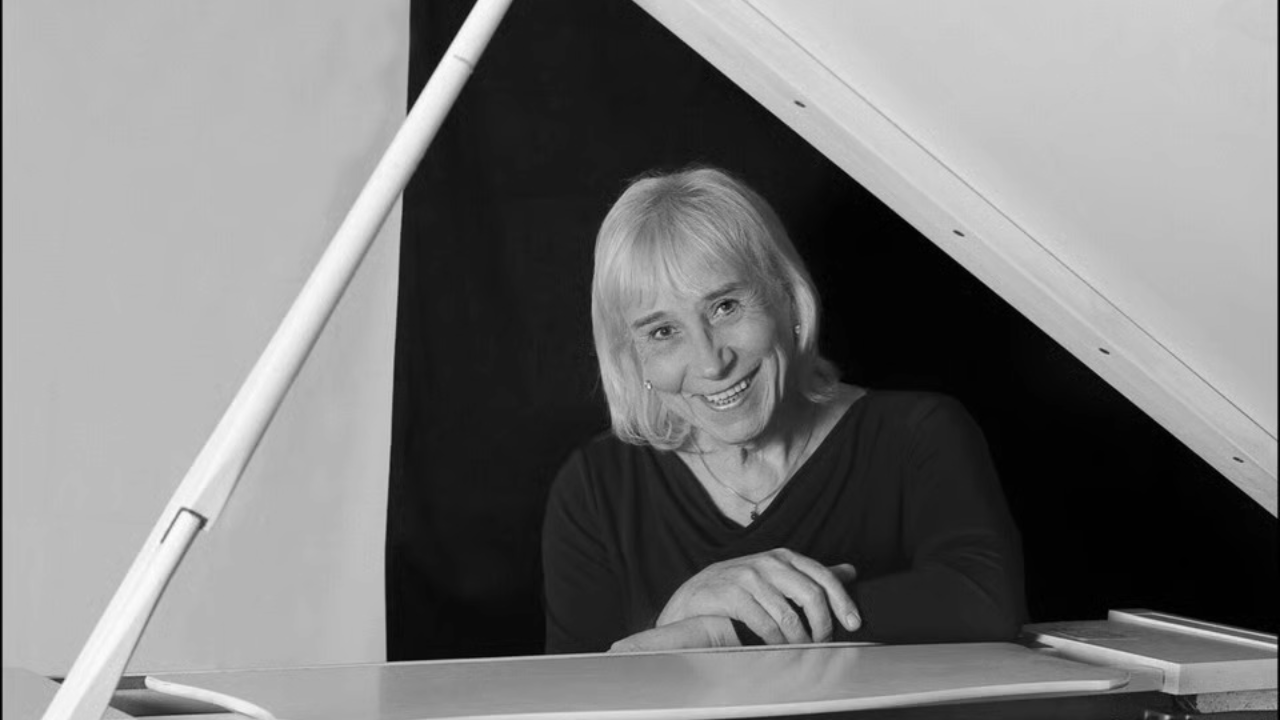 The late Dee Palmer at the piano