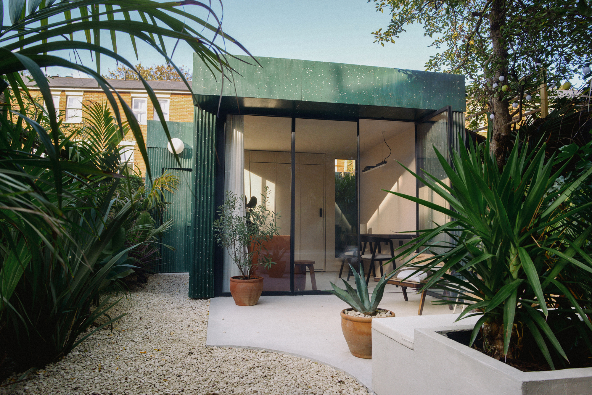 a terrazzo garden studio with a work space inside