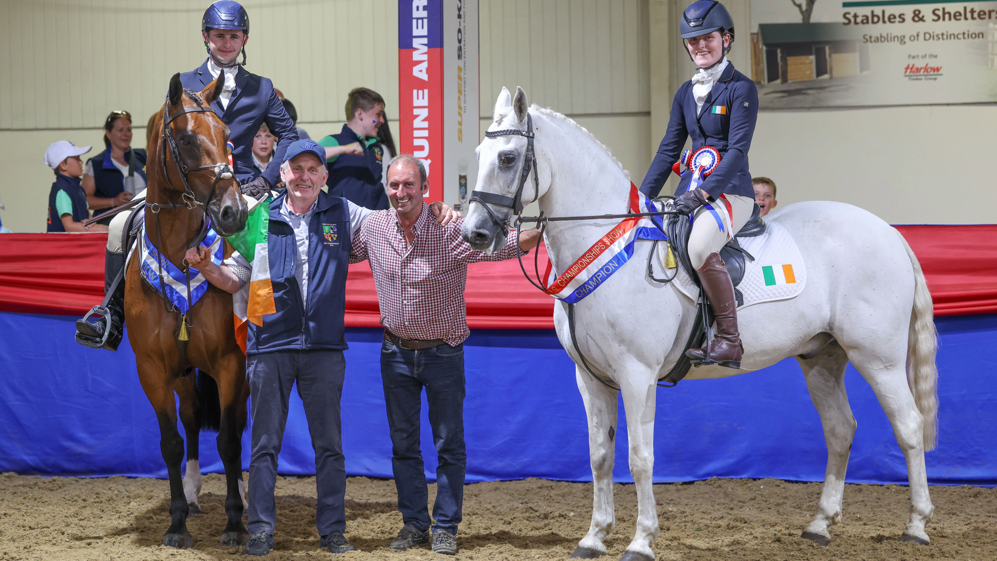 Max Odonnell sits on his bay pony WKD Little Gift and Evie Kennedy on grey Little Dromin Phoenix with their team managers in between them