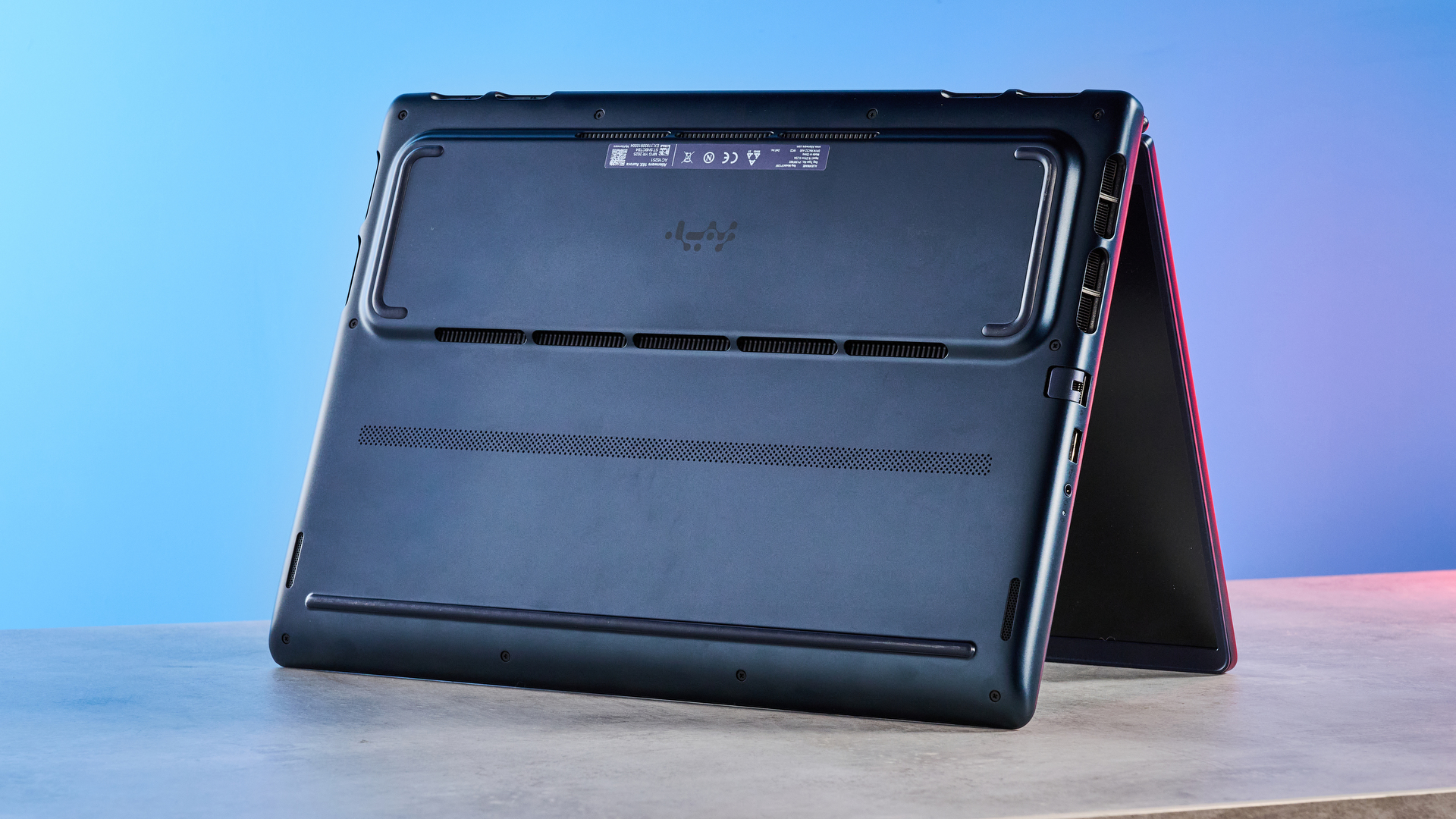 A blue Alienware 16X Aurora gaming laptop