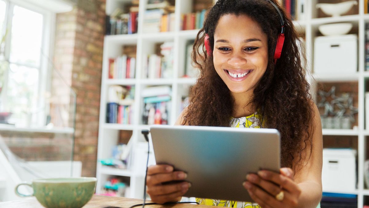 best tablets 2022L image shows young woman holding tablet