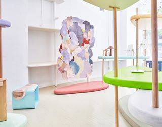 Colourful exhibition structure in white bare space