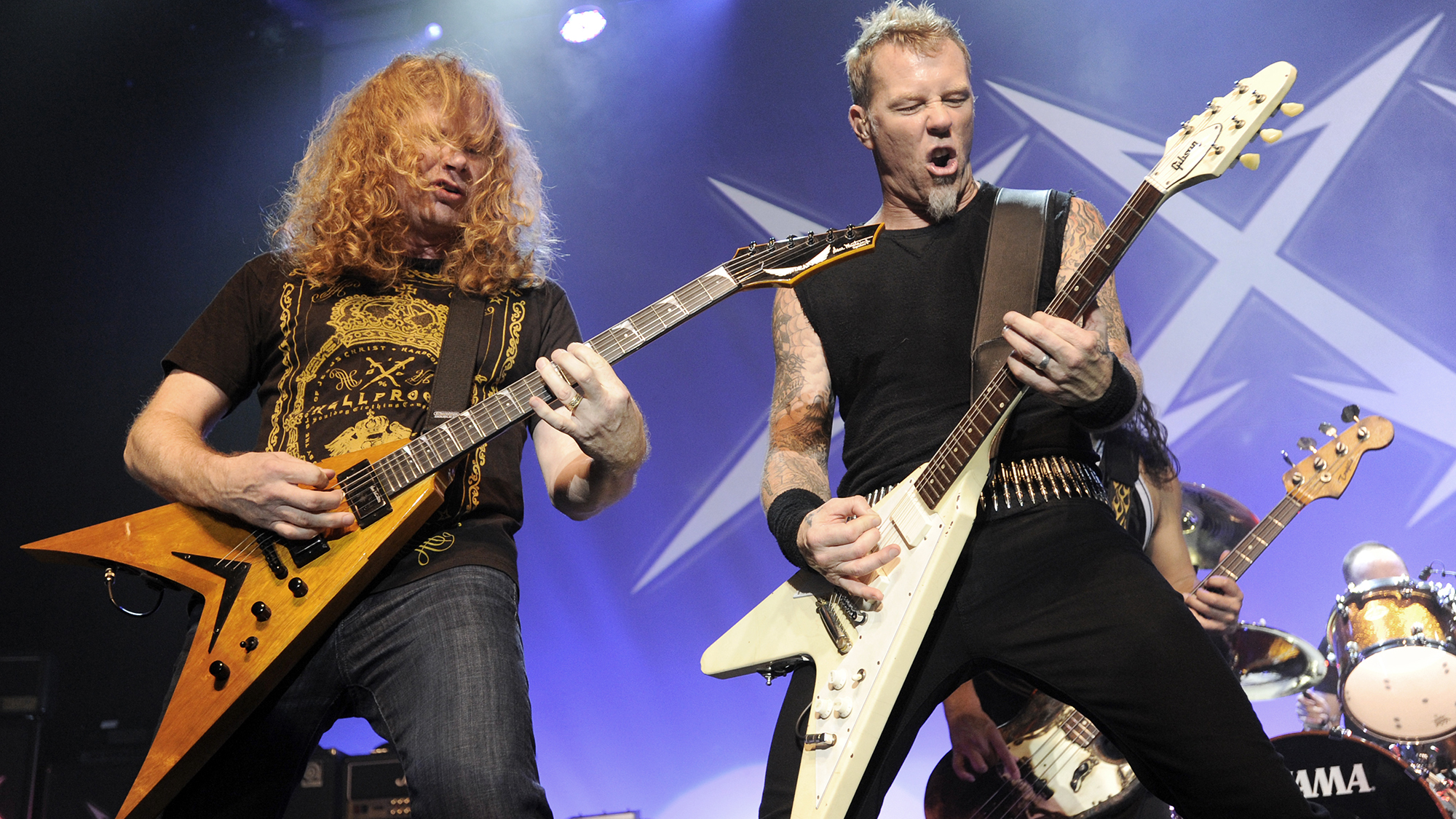 Dave Mustaine of Megadeth (L) and James Hetfield of Metallica perform during night four of the band's 30th Anniversary at The Fillmore on December 10, 2011 in San Francisco, California.