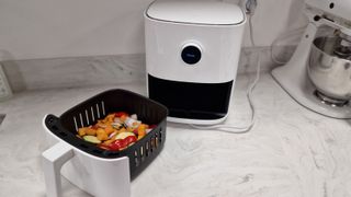 Xiaomi Mi Smart Air Fryer with vegetables in the cooking drawer