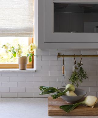 grey kitchen with brass hooks