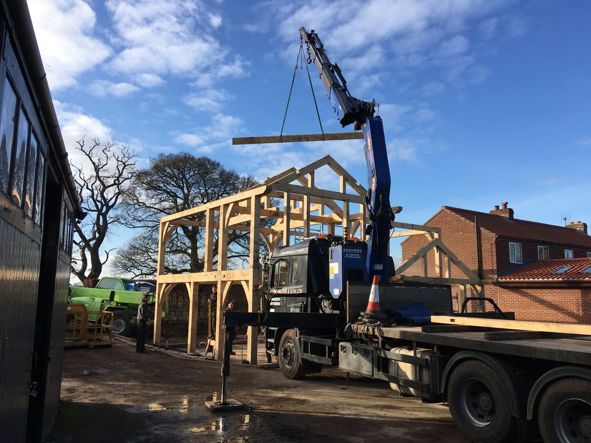 During: The oak frame being erected
