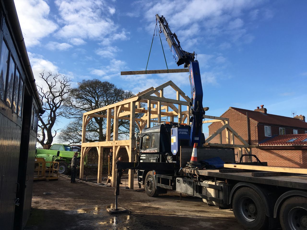 During: The oak frame being erected