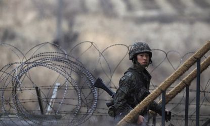 A South Korean soldier walks up the stairs at an observation post on March 12, near the demilitarized zone, which separates the Koreas.