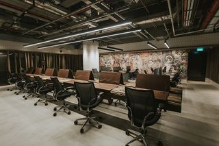 The Bardo co-working space with a long row of desks and chairs