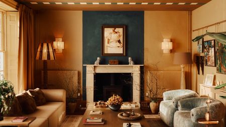 Deep beige sitting room with checkerboard stripes painted on the ceiling