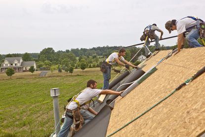 Men installing a roof