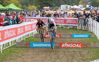 Eli Iserbyt and Michael Vanthourenhout on the barriers at the Waterloo UCI Cyclo-cross World Cup men's elite race 2021