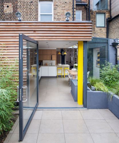 Patio garden leading on from home extension 