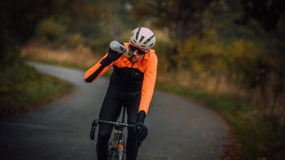 Image shows a rider on a winter bike ride