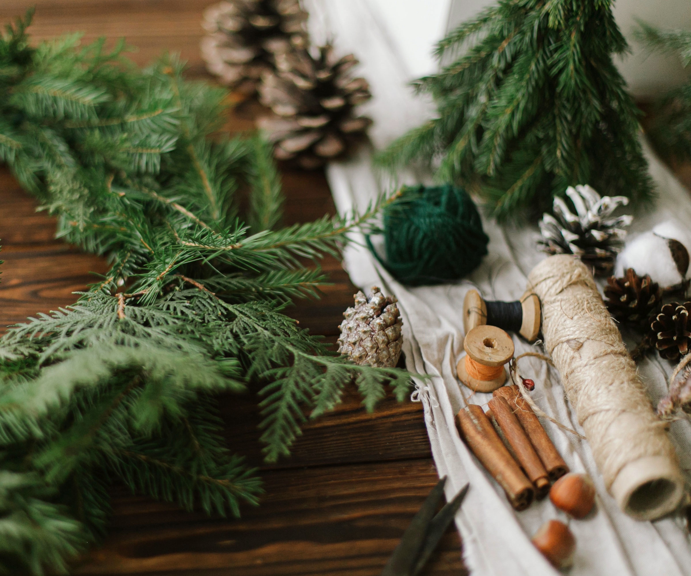 Christmas tree garland leaves, pine cones, thread and twine
