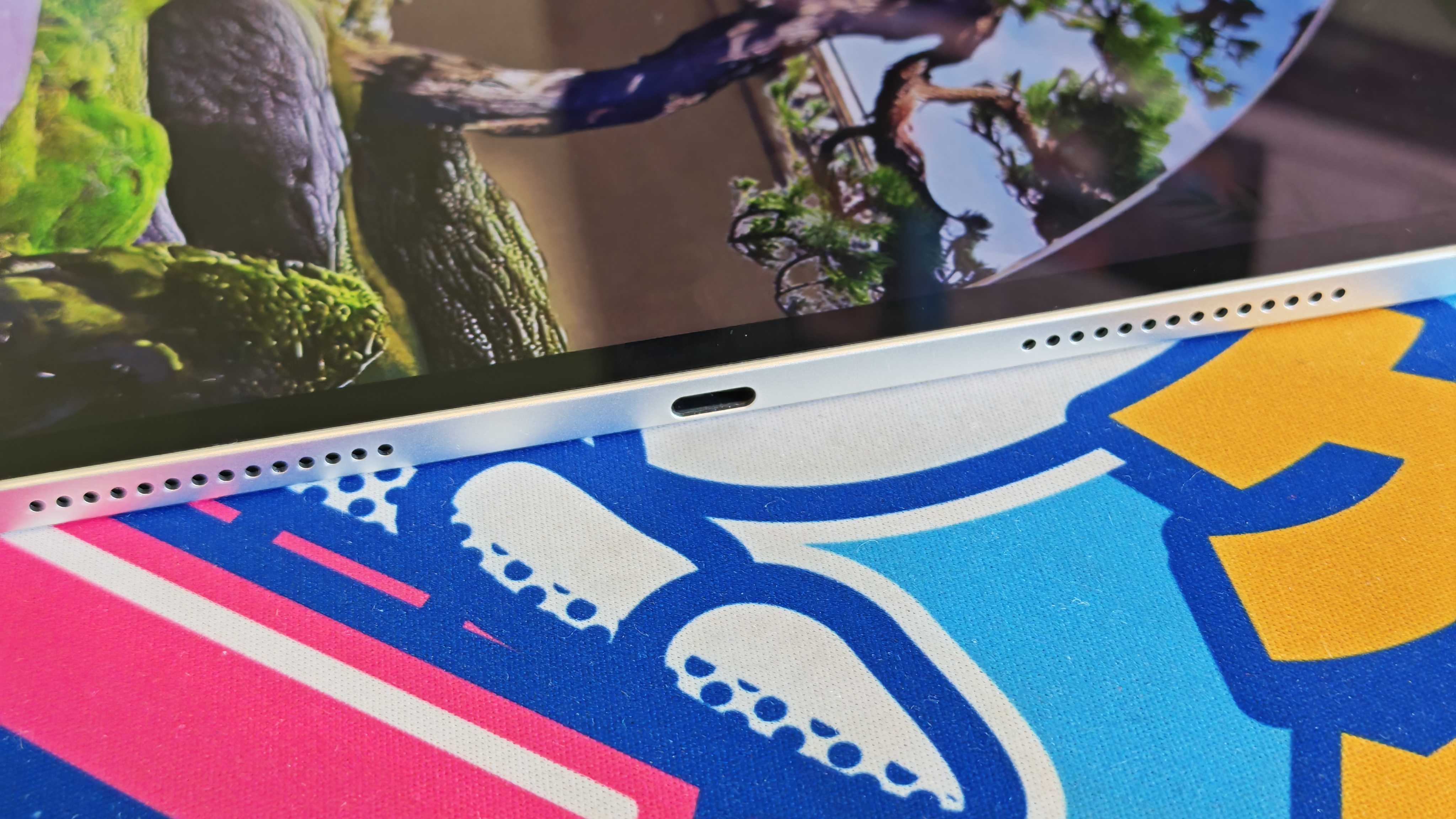 The Honor MagicPad 3 placed on a colorful desk mat.