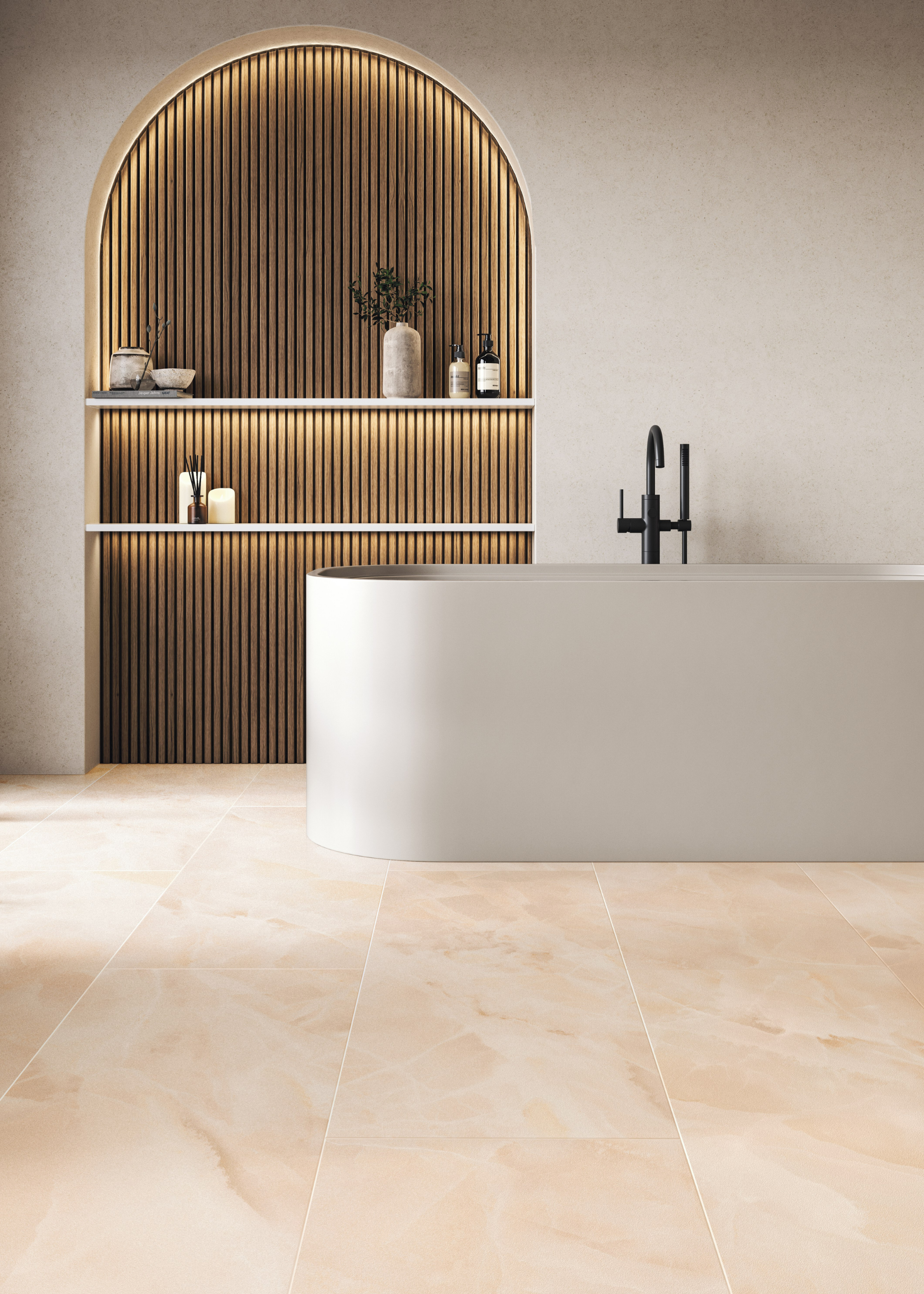 A bathroom with stone flooring, a standing bathtub, an arched backlit nook with shelving