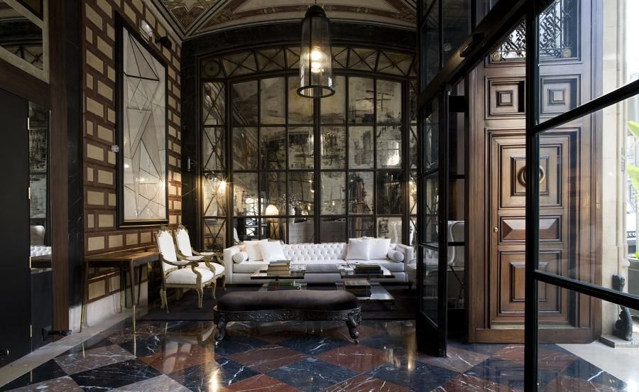 Cotton House Hotel Foyer features large wooden doors, glass and wood panelling &amp; marble floors 