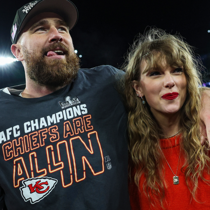 Travis Kelce #87 of the Kansas City Chiefs (L) celebrates with Taylor Swift after defeating the Baltimore Ravens in the AFC Championship Game at M&T Bank Stadium on January 28, 2024