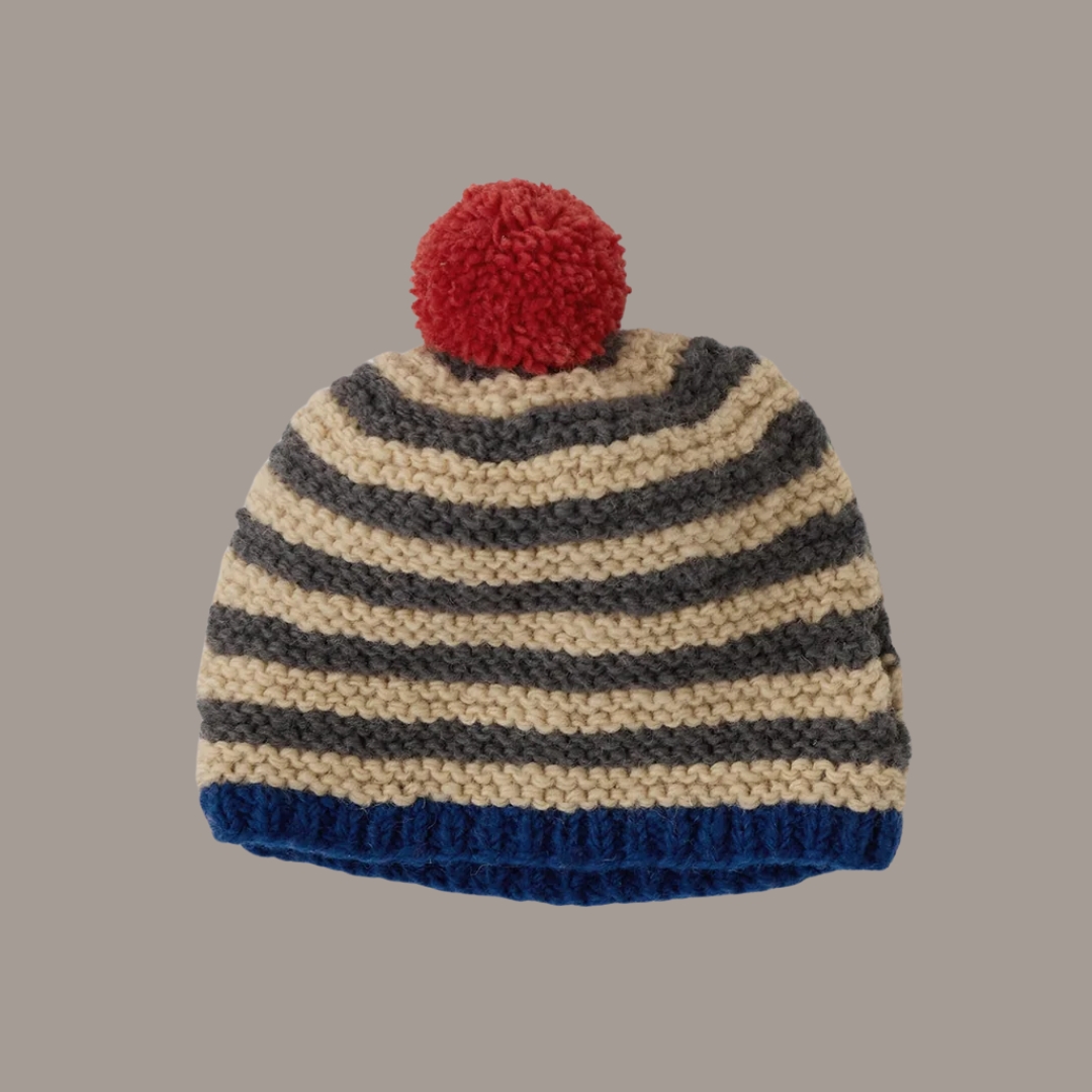 TOAST Knitted Stripe Wool Tea Cosy against pale brown background.