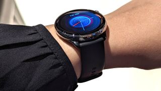 Amazfit GTR Mini smartwatch worn on a wrist, showcasing a watch face.