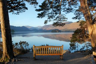 Britain's most romantic places to visit: bench overlooking Derwentwater in keswick in the lake district
