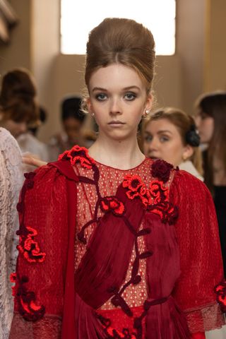 Model at Bora Aksu SS25 wearing a beehive, ones of the key Spring/Summer 25 fashion month beauty looks