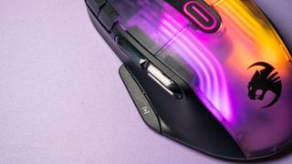 Roccat Kone XP with its RGB lighting in full display on a purple desk mat