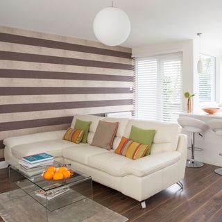 living room with sofa and glass table