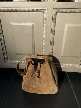 A brown suede Saint Laurent Le 5 a 7 shoulder bag.