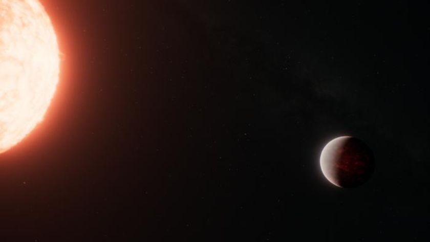 A small brown exoplanet is seen in space to the right of a sun-like star