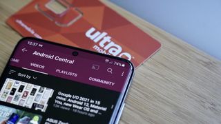 Ultra Mobile SIM and phone showing YouTube app