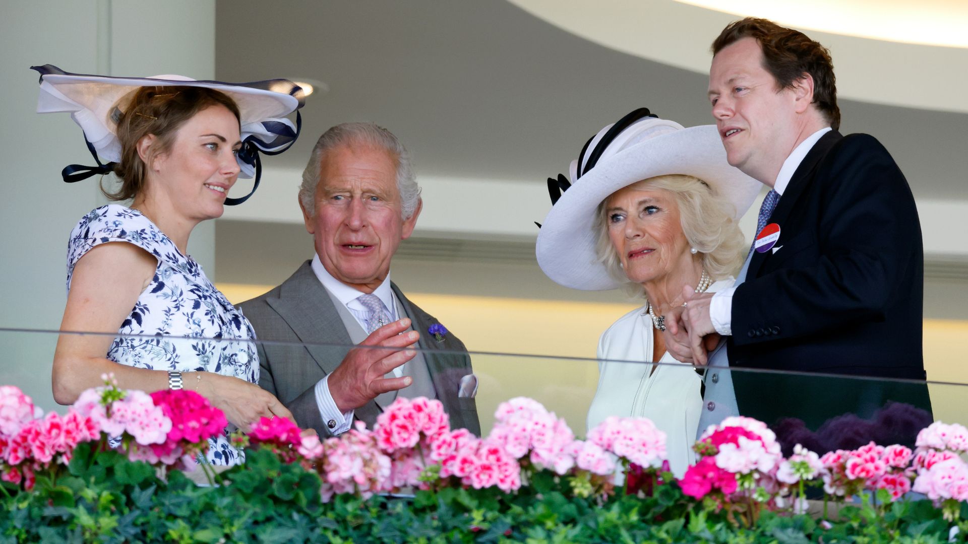 King Charles III, Queen Camilla and Tom Parker Bowles watch the racing from the Royal Box as they attend day four of Royal Ascot 2023