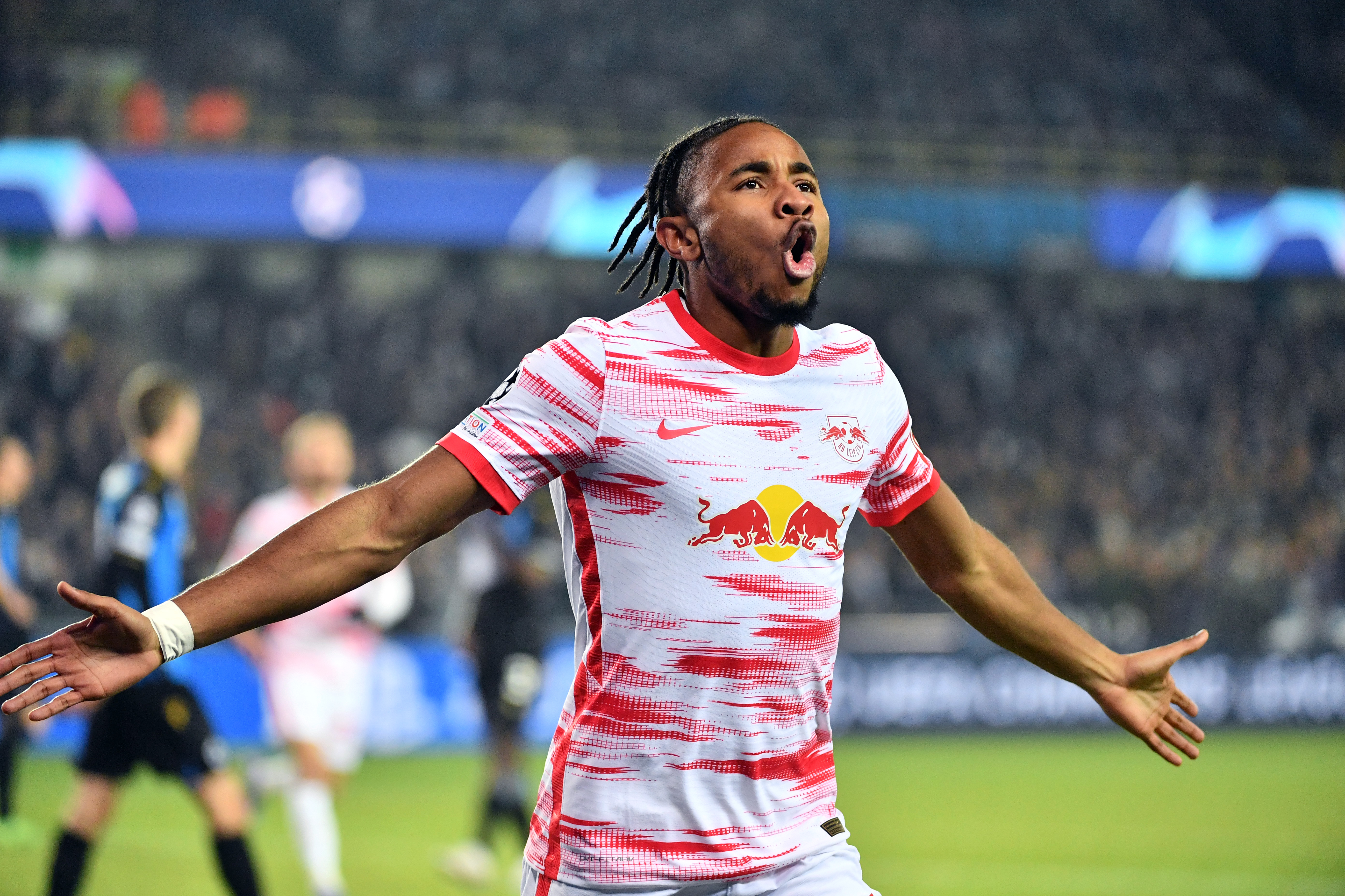 Chripstoper Nkunku celebrates a goal for RB Leipzig against Club Brugge in the Champions League in November 2021.