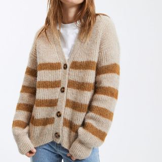 Cropped image of woman wearing striped cardigan