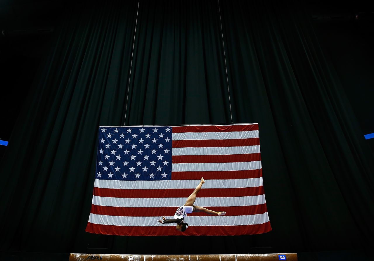 Simone Biles performs a gymnastics routine.