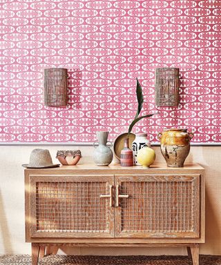 Sideboard with pink wallpaper