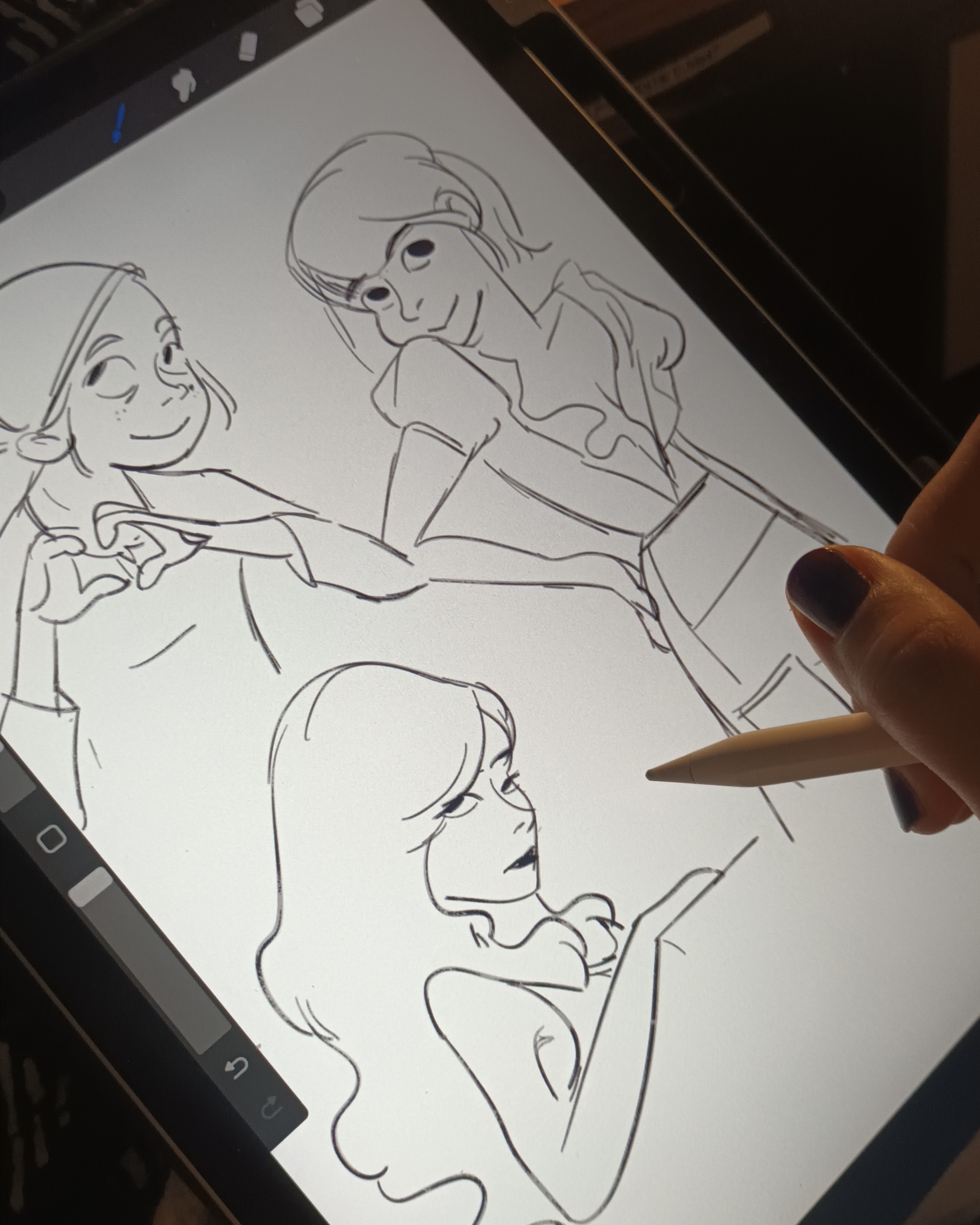 Artist sketchbook; a drawing of a female character on an iPad
