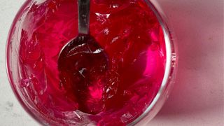 Red jelly in glass jar