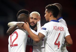 Neymar (centre) is congratulated by team-mates after scoring PSG's third goal