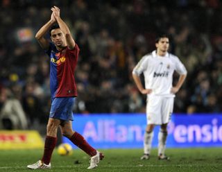 Barcelona midfielder Xavi applauds after leaving the pitch against Real Madrid in December 2008.
