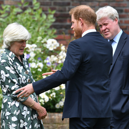 Prince Harry, Duke of Sussex with his aunt Lady Jane Fellowes and uncle Earl Spencer during the unveiling of a statue of Diana, Princess of Wales, in the Sunken Garden at Kensington Palace